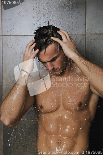 Image of good looking man under man shower