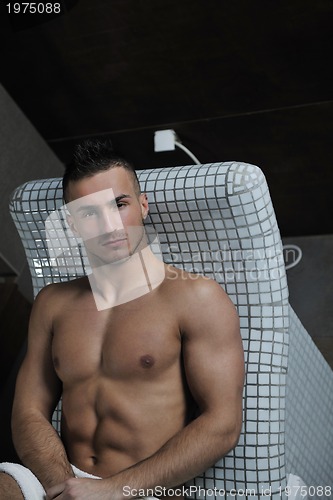 Image of attractive young man in sauna