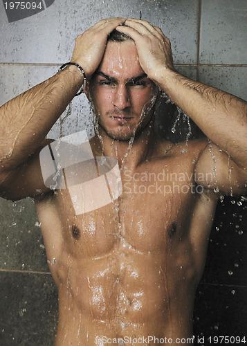 Image of good looking man under man shower