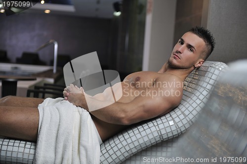 Image of attractive young man in sauna