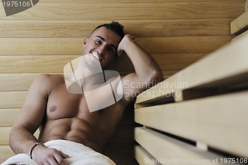 Image of attractive young man in sauna