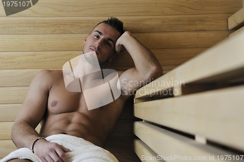 Image of attractive young man in sauna