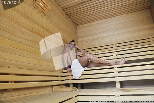 Image of attractive young man in sauna