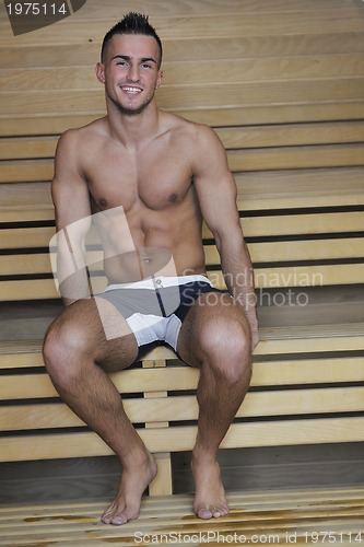 Image of attractive young man in sauna