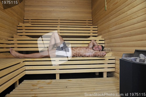 Image of attractive young man in sauna