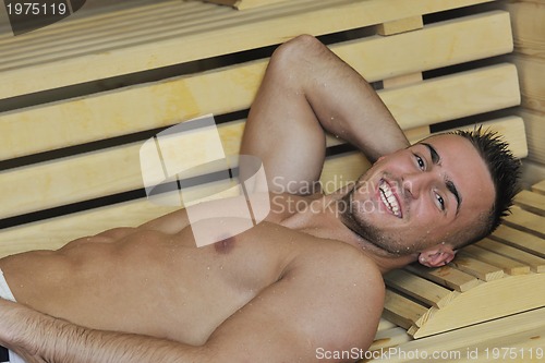 Image of attractive young man in sauna