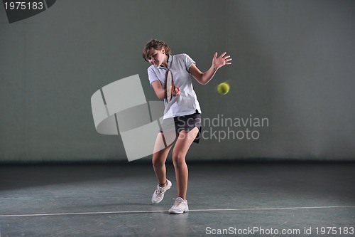 Image of one young woman play tennis