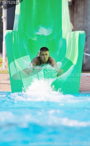 Image of water slide fun on outdoor pool