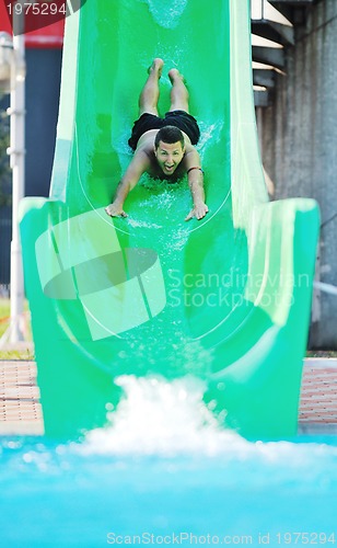 Image of water slide fun on outdoor pool