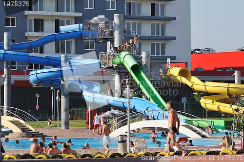 Image of water slide fun on outdoor pool