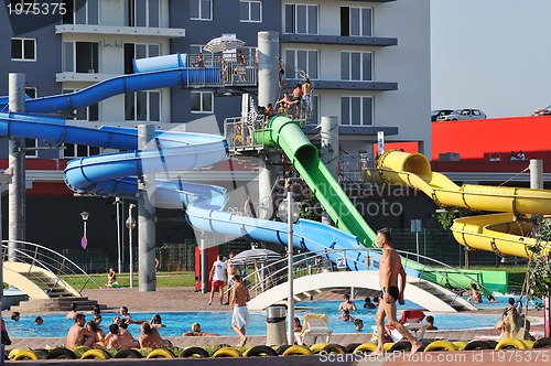 Image of water slide fun on outdoor pool