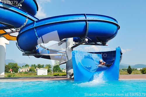 Image of water slide fun on outdoor pool