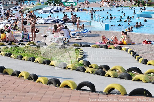 Image of water slide fun on outdoor pool