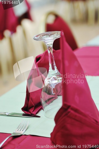 Image of restaurant table with empty wine glass