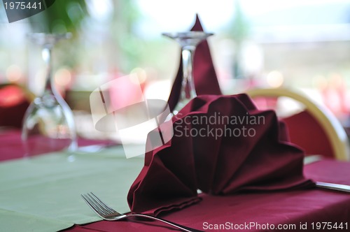 Image of restaurant table with empty wine glass