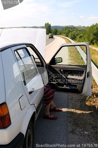 Image of Young woman waiting in car