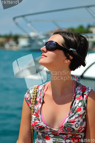 Image of Young pretty woman enjoying the sun