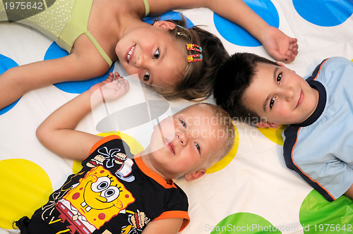 Image of Happy three kids playing together