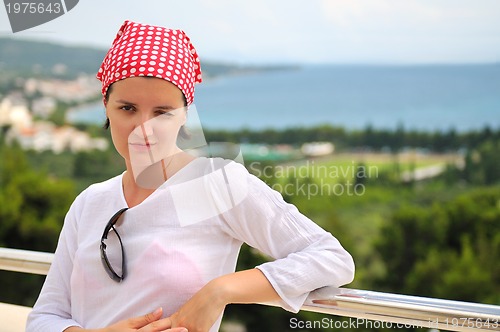 Image of Young pretty woman enjoying the sun