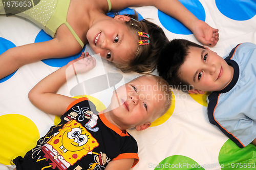 Image of Happy three kids playing together