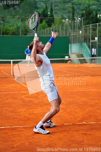 Image of One man play tennis outdoors