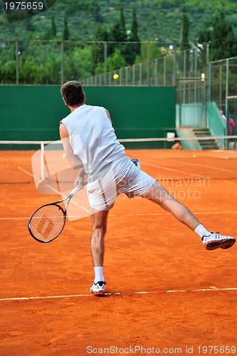 Image of One man play tennis outdoors