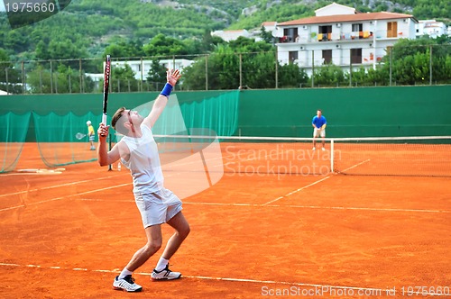 Image of One man play tennis outdoors