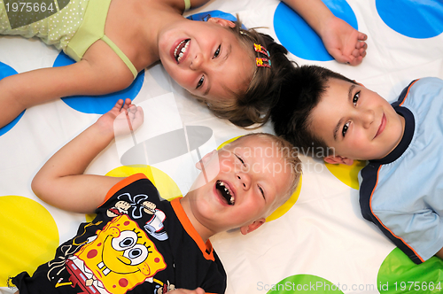 Image of Happy three kids playing together