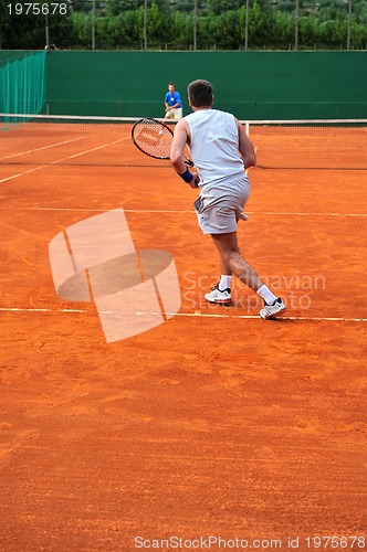 Image of One man play tennis outdoors