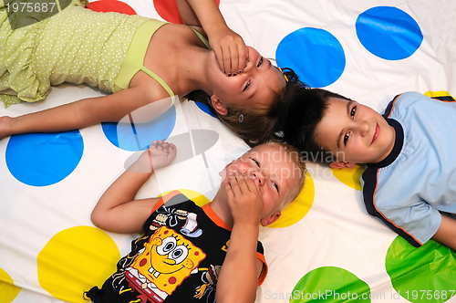 Image of Happy three kids playing together