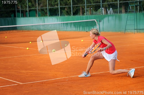 Image of Girl playing tennis outdoor