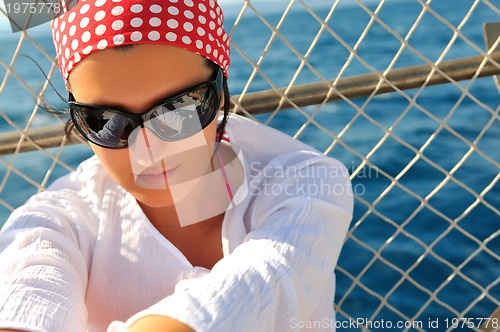 Image of woman with sunglasses outdoor