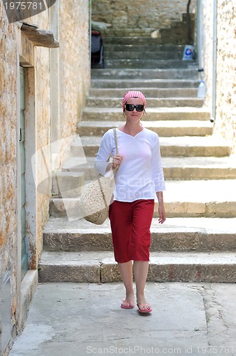 Image of woman walk on street