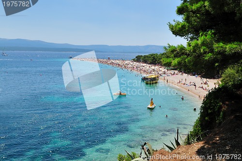 Image of people relaxing on beach