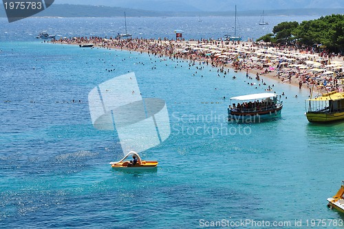 Image of people relaxing on beach