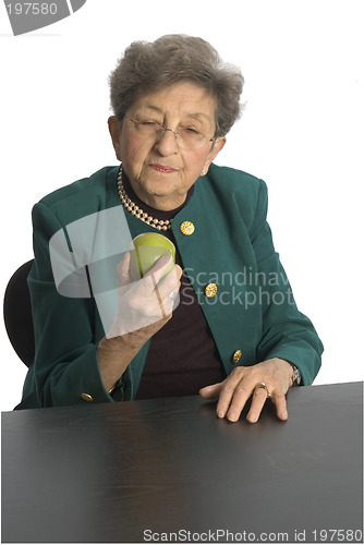 Image of senior woman with apple