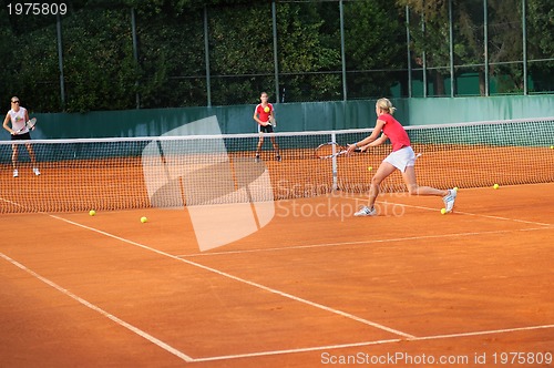 Image of Girl playing tennis outdoor