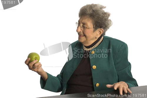 Image of senior woman with apple