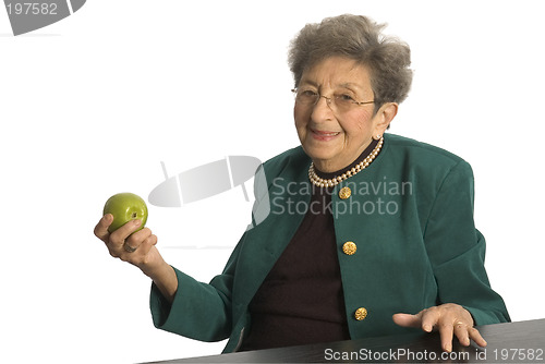 Image of senior woman with apple