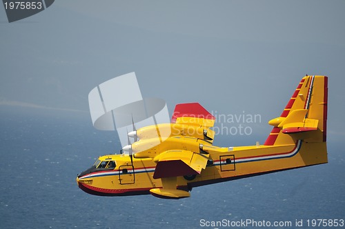 Image of Airplane on sea taking water