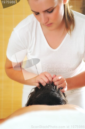 Image of head and hair massage at the spa and wellness center