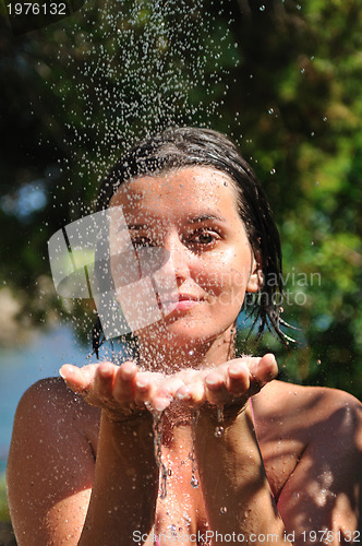 Image of young pretty woman relaxing under shower