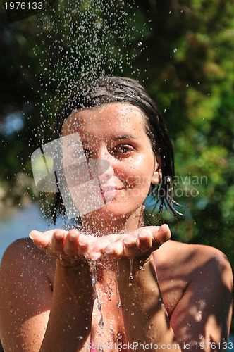 Image of young pretty woman relaxing under shower