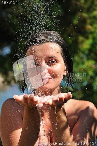 Image of young pretty woman relaxing under shower