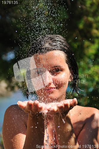 Image of young pretty woman relaxing under shower