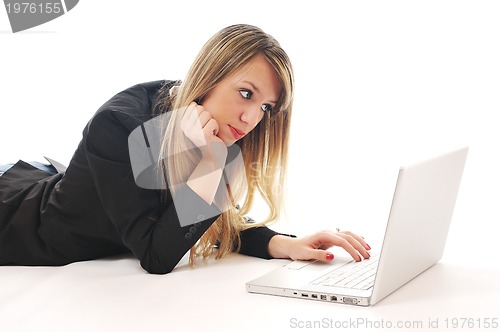 Image of one young girl work on laptop isolated on white