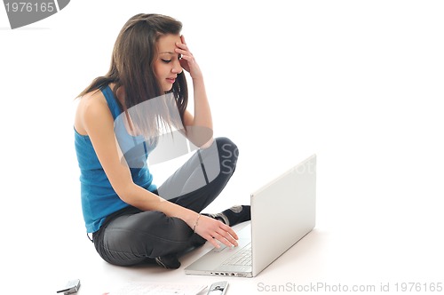 Image of one young girl work on laptop isolated on white