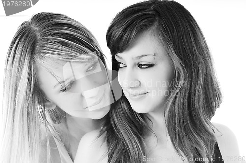 Image of two young girls isolated on white