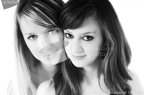 Image of two young girls isolated on white