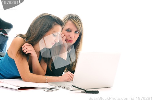 Image of two young girls work on laptop isolated